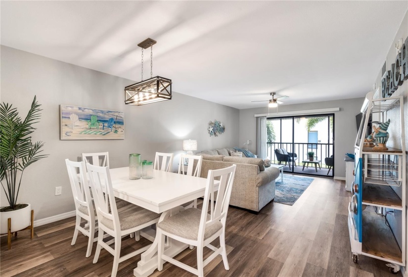 Dining room looks onto living room and lanai