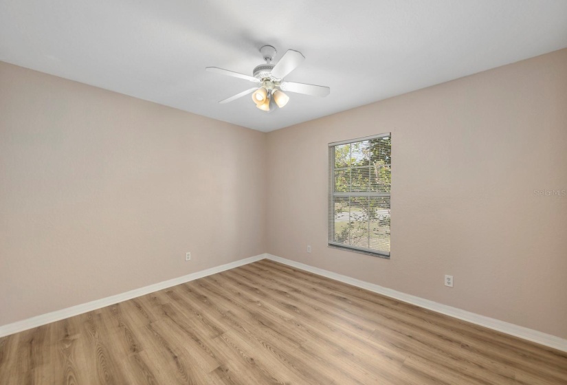 Guest bedroom at front of the home - opposite side from primary for privacy