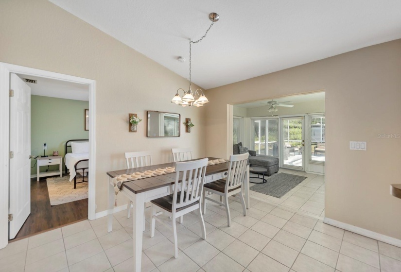 Dining room right off the kitchen. Open door leads to the primary bedroom