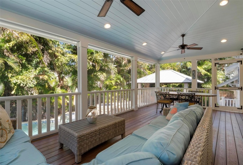 Main level porch with access to pool and cabana