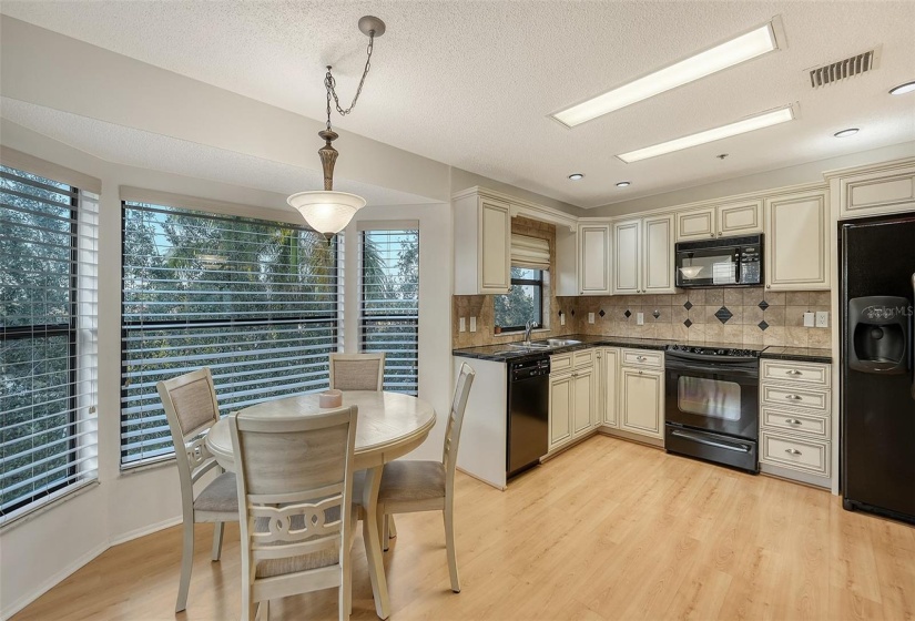 Eat in kitchen nook with views down to the pool