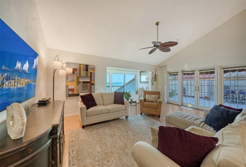 The Open Great Room with Vaulted Ceilings and french doors out to private rooftop terrace