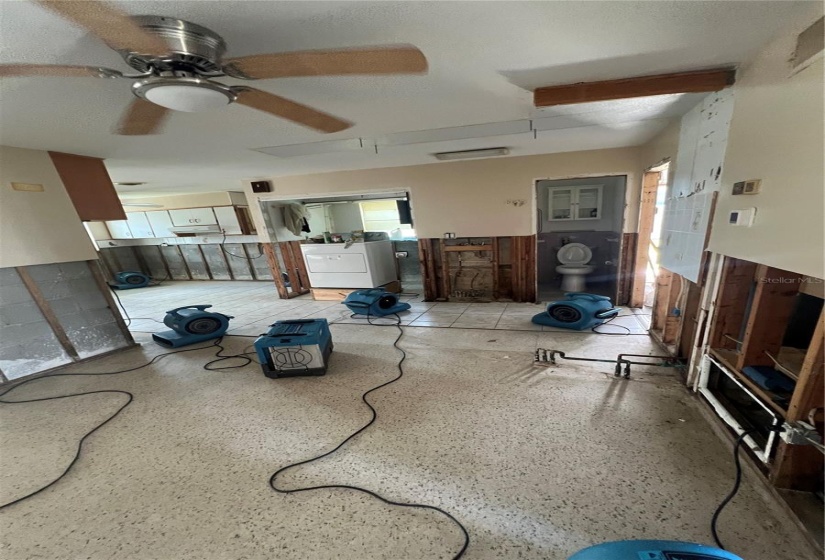 From the Dining Room looking towards the kitchen, laundry area and 3rd bath