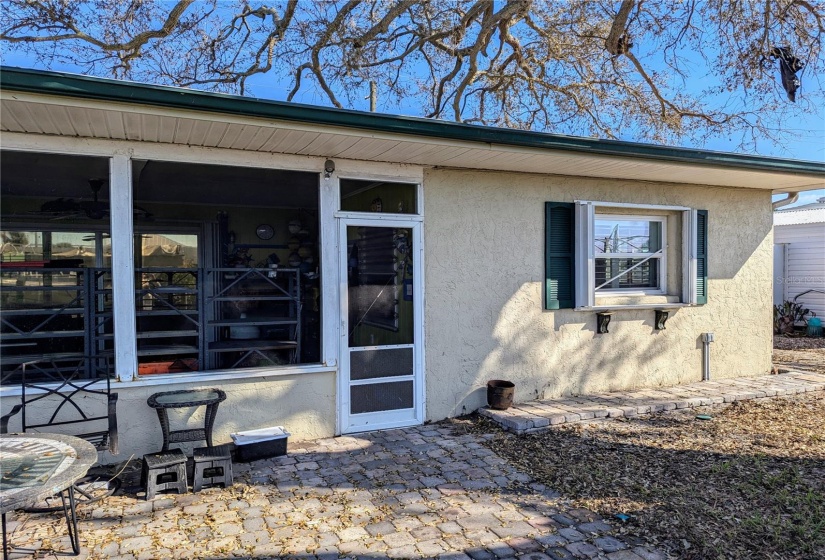 Screened patio faces canal.