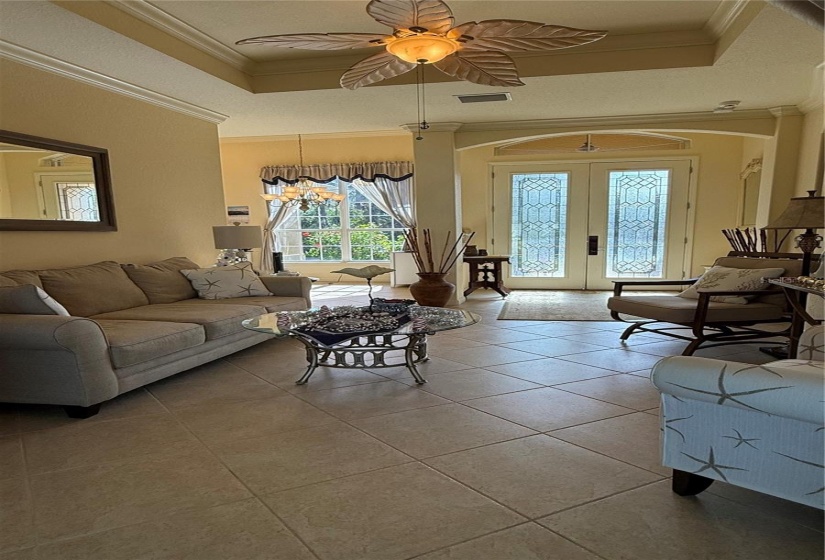 Living Room features crown molding and coffer ceiling