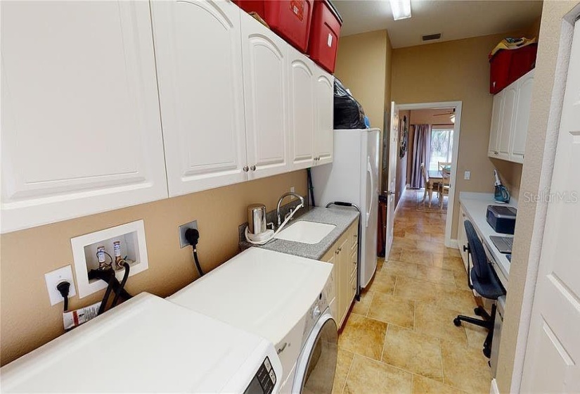 Laundry room of guest house side of Duplex at Tall Palms Ranch