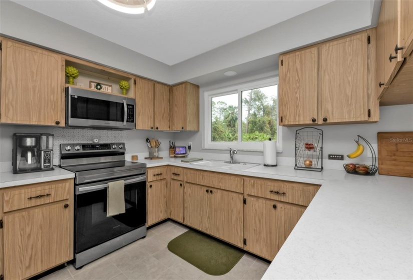 very user friendly kitchen with lots of cabinets and SPACE