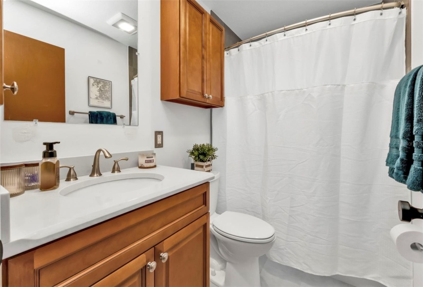 beautiful 2nd bath has a tub and new vanity and fixtures