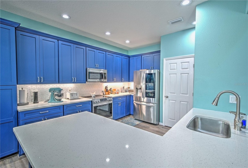 Quartz countertops, tile backsplash, and additional pantry added in 2021