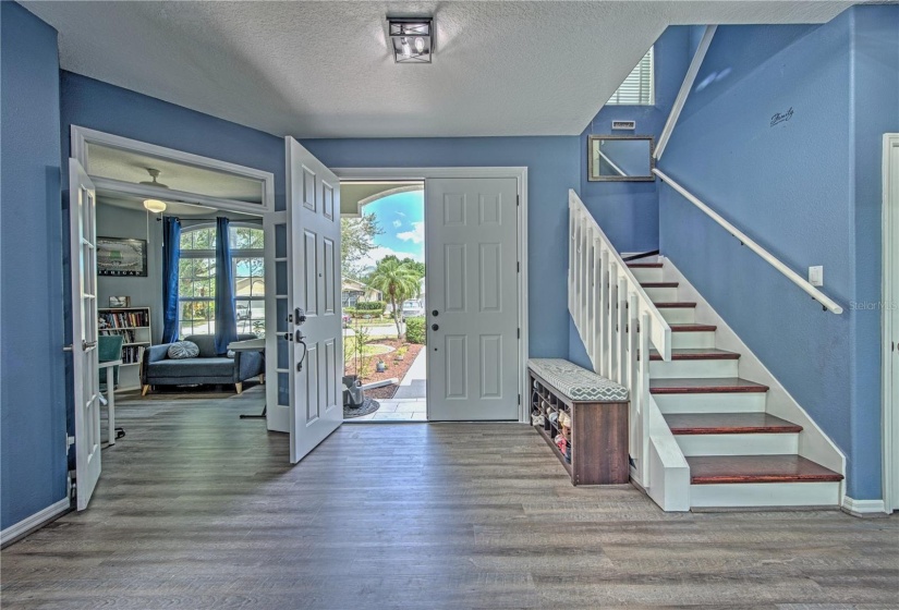 Spacious foyer with a large office space to the left