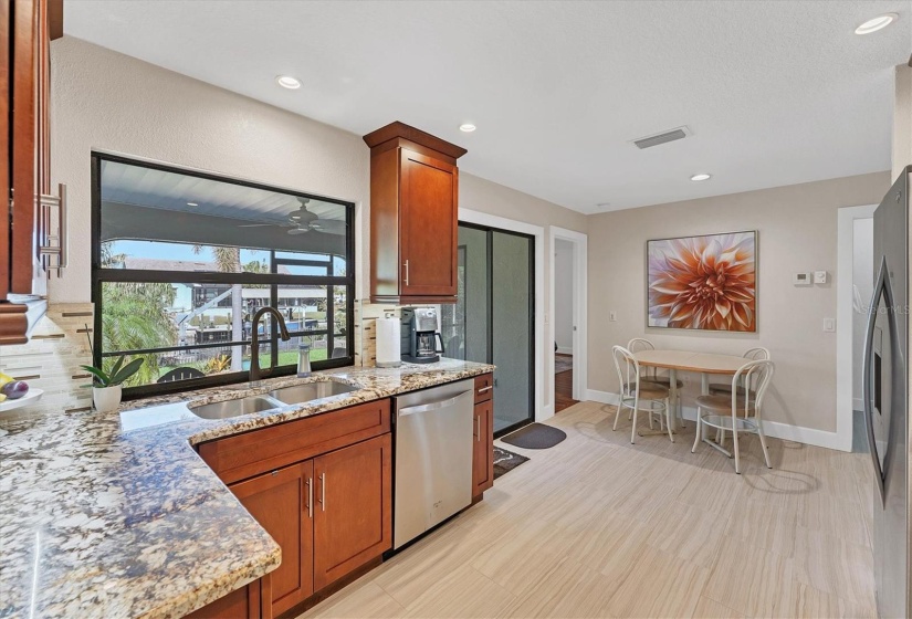 Kitchen & view of Lanai & Canal.