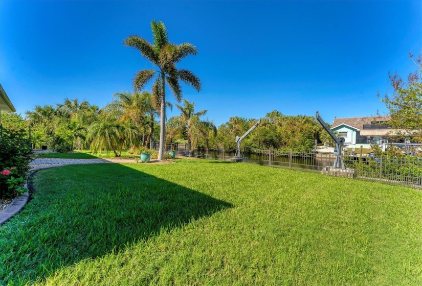 Manicured Yard overlooking Canal.