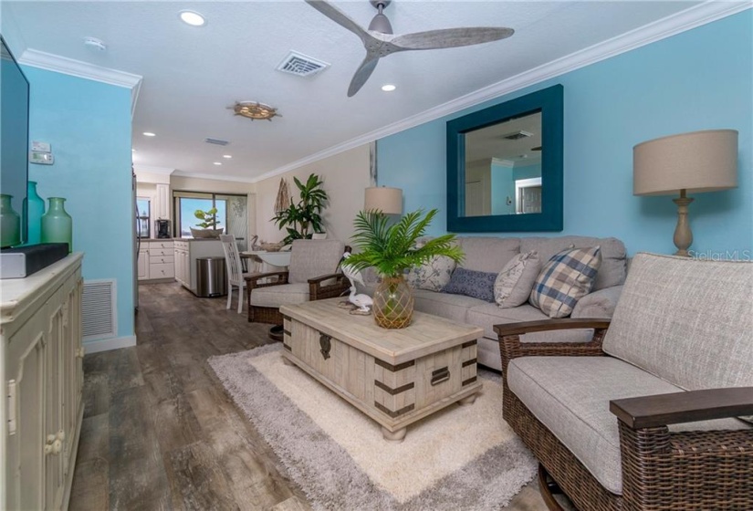 This home has been furnished with new furniture and decor that creates a soothing, coastal vibe.