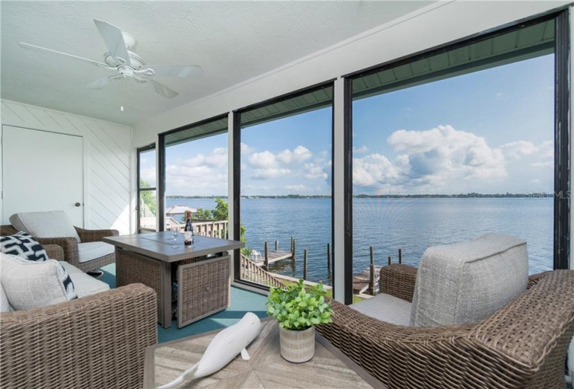 The screened lanai overlooking the bay is a great place to relax.