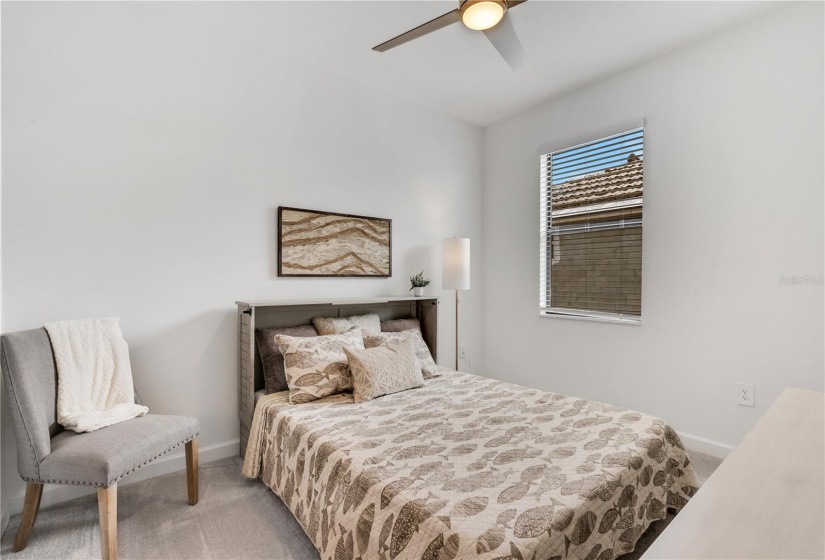 Third bedroom with queen size murphy bed doubles as an office/ extra TV room.