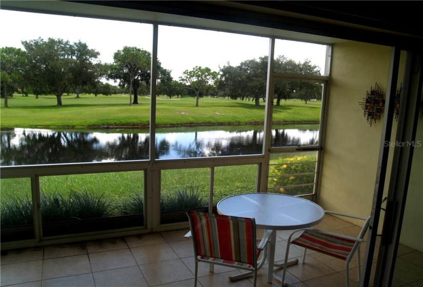 Lanai with water and golf course views