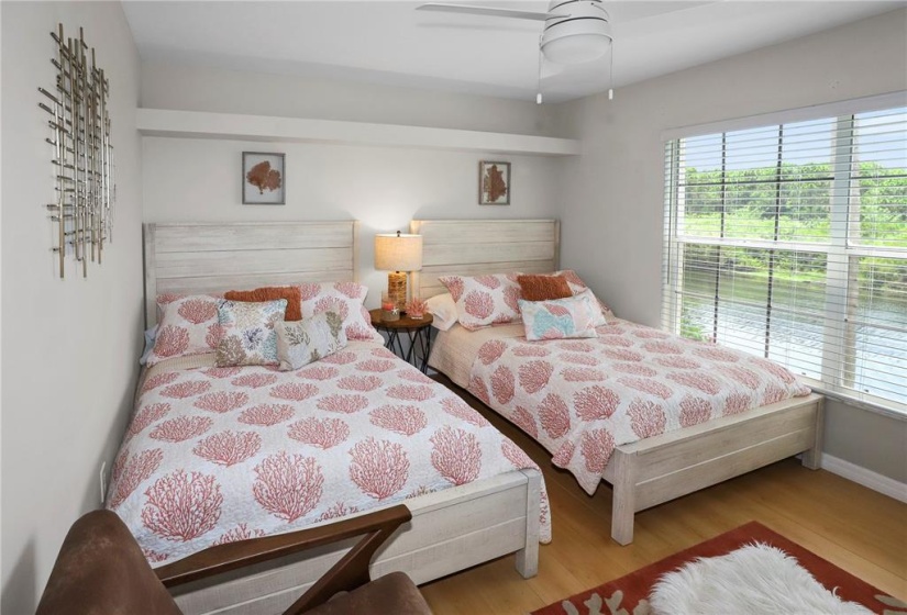 Second bedroom with two queen beds, walk in closet and water view