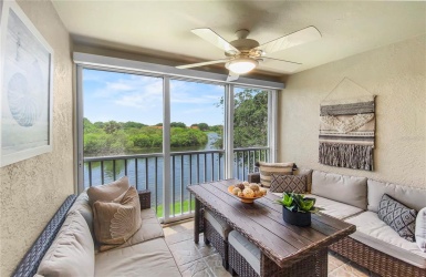 Screened in Lanai with sliding glass doors and water view