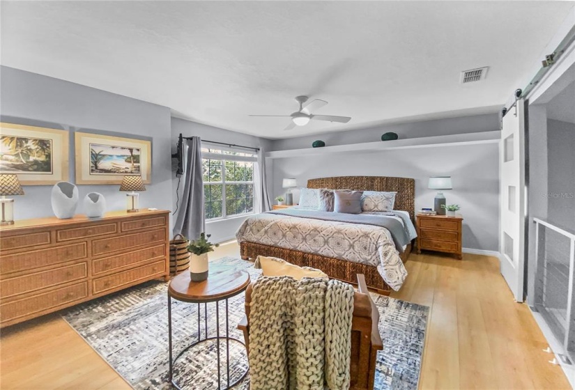 Main bedroom upstairs with water view and ensuite bathroom