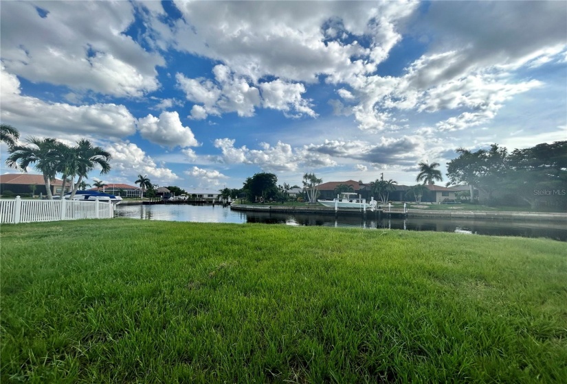 Blue skies and green grass and water in between ... Oh and palm trees with drifty clouds....there is definitely a song in there somewhere!