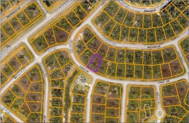 Aerial view; lot is outlined in purple.  Lot to the left is getting a new house right now.