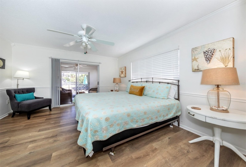 Primary bedroom overlooking the bonus room out back.  Furniture is being left with the home.