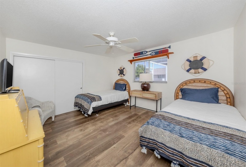 Third bedroom facing the pool deck area.  Great space if you need it. Furniture, TV being left with the home.