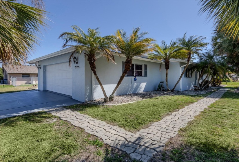 Garage is on Lehigh Rd for this marvelous corner pool home.