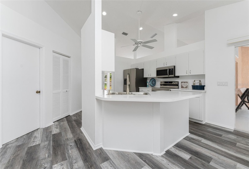 LOOKING TOWARDS LAUNDRY ROOM,  GARAGE DOOR and CLOSET PANTRY