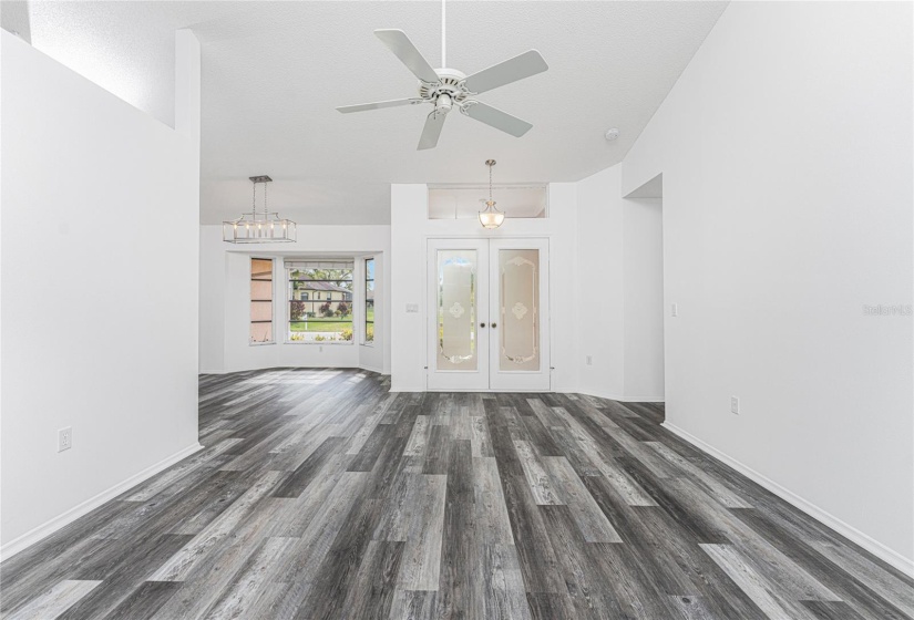 LOOKING TOWARDS FRONT DOORS / DINING AREA FROM LIVING ROOM