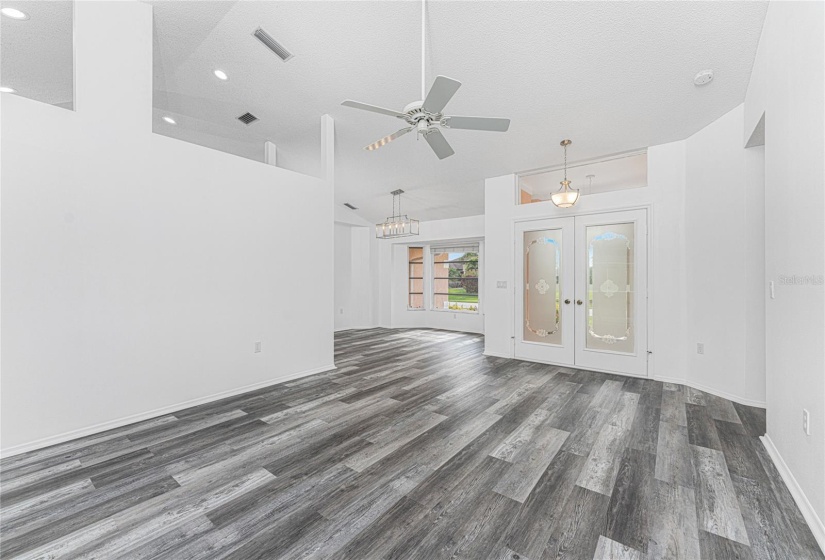 LOOKING TOWARDS FRONT DOORS / DINING AREA FROM LIVING ROOM