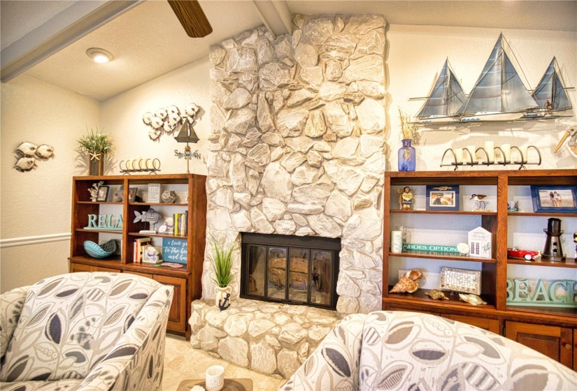 Cathedral ceiling family room with built-ins & fireplace