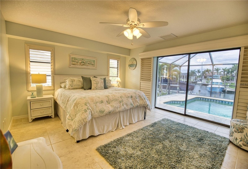 Primary Bedroom with sliders to pool & deck